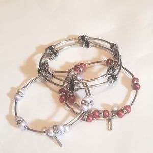 One Red & One White Vantel Pearl's Bracelets. One Black Infinity wrap Bracelet